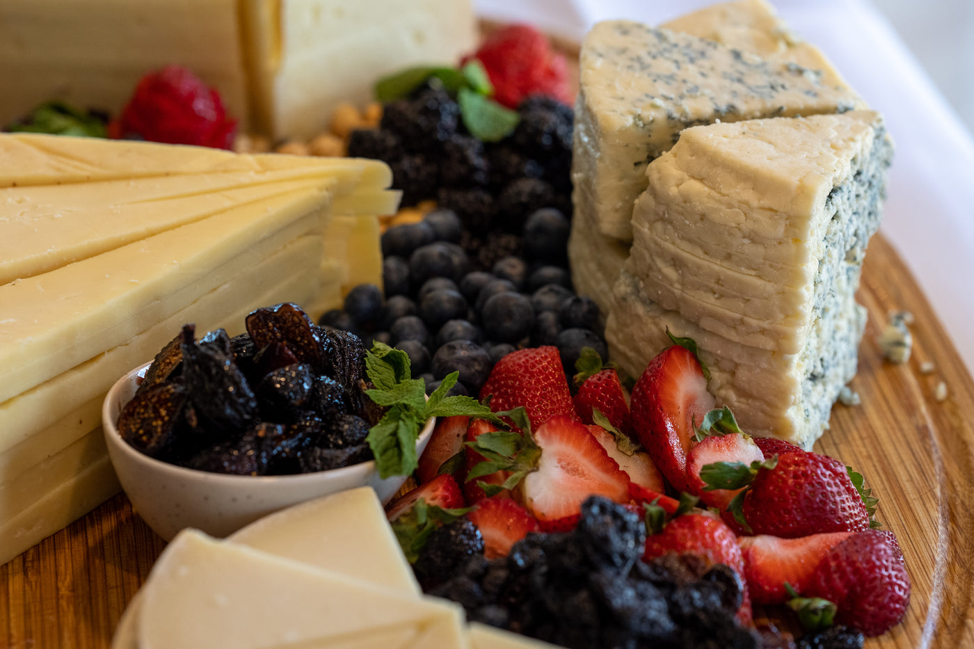 meat and cheese subscription box image of cheese and fruit