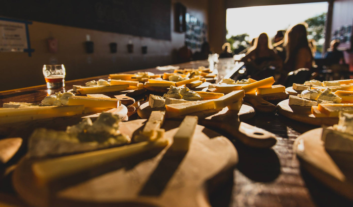 Image of cheese on plates prior to a tasting | sustainability