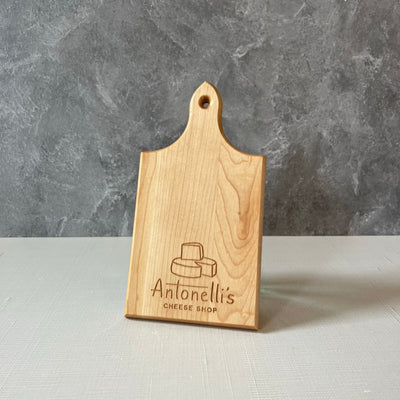 Small QT cutting board with Antonelli's Cheese logo 6 inches