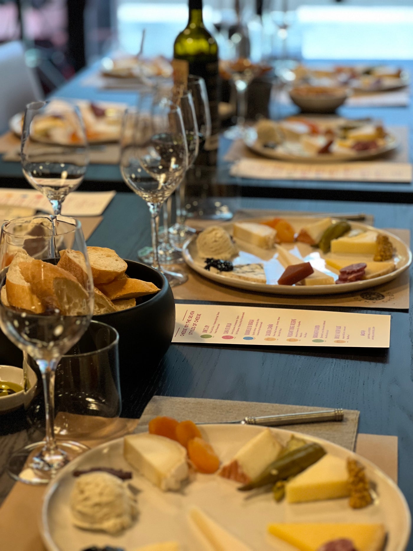 Image of a table scape at South Lamar tasting room including cheese plates