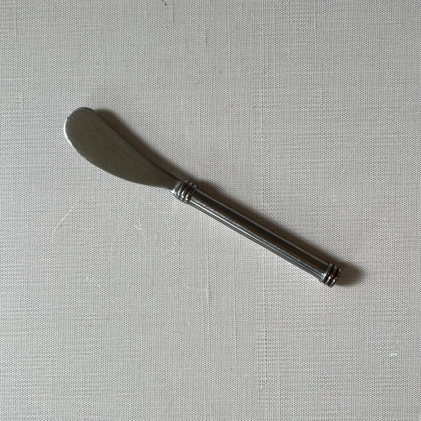 Stainless steel spreader knife about 4 inches long