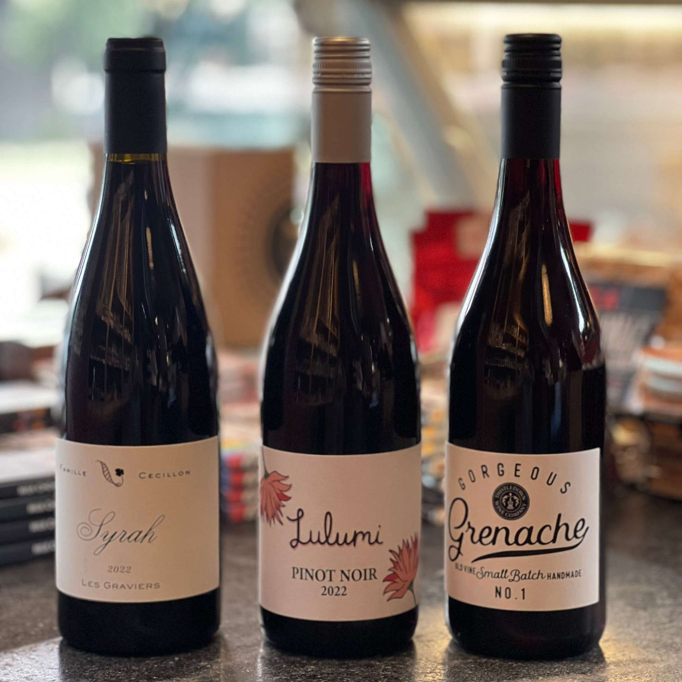 Bottle of red wine for cheese pairing with notes of dark fruit and smooth finish.