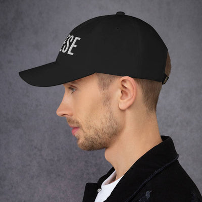 Man wearing CHEESE' Hat, black dad hat with curved visor and adjustable strap.