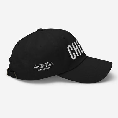 Black "CHEESE" hat with adjustable strap and curved visor.