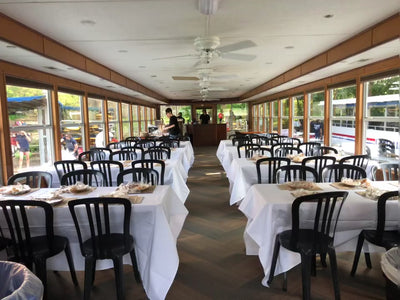 Image of team setting up a tasting on a boat 