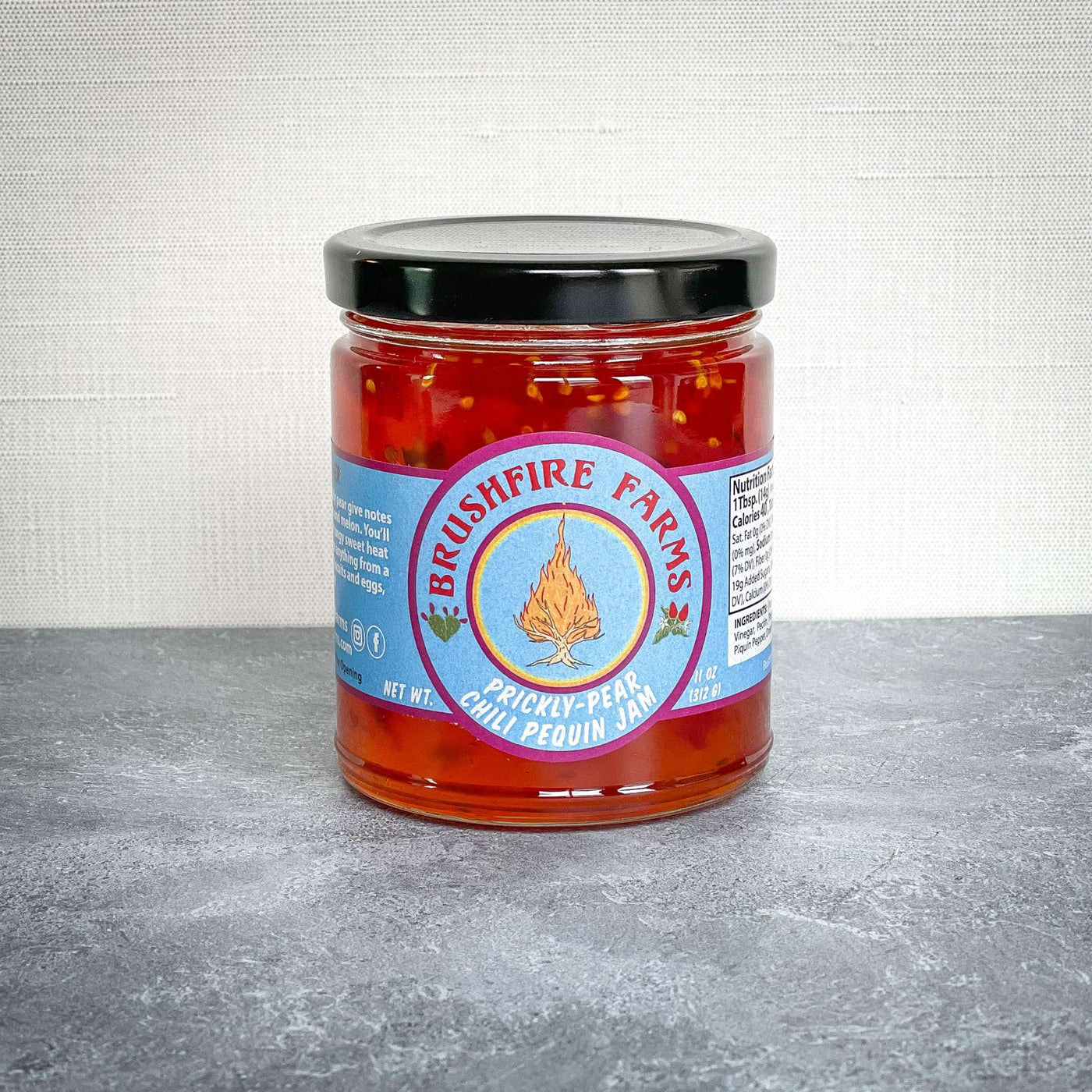 Brushfire Farms Prickly Pear Chili Pequin Jam from San Antonio, TX on a table.