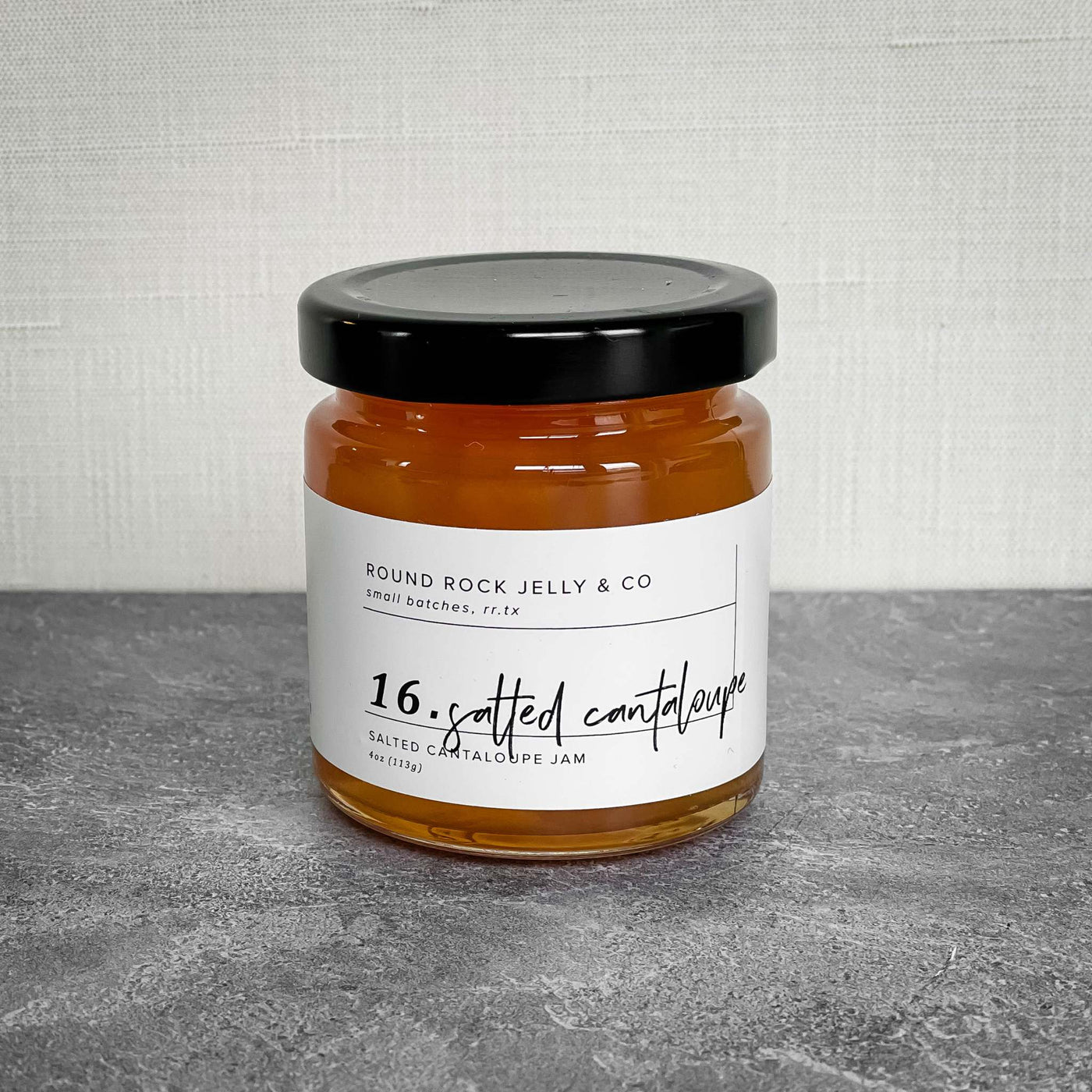 4oz salted cantaloupe jelly by Round Rock Jelly Co. on gray surface