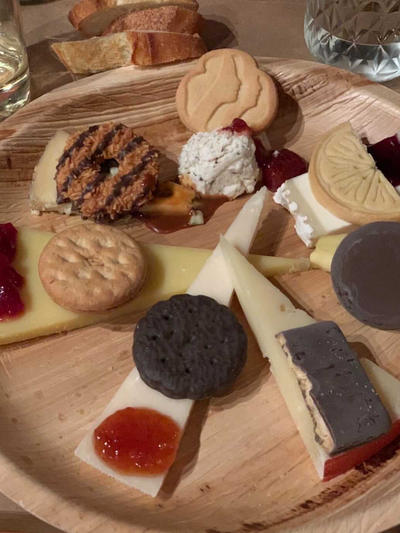 Plate featuring a selection of cheeses paired with Girl Scout cookies, showcasing the unique Cookies & Cheese pairing event.
