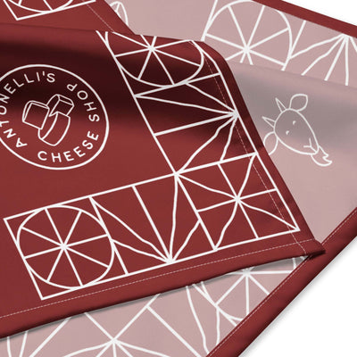 All-over print bandana with geometric design and cheese shop logo.