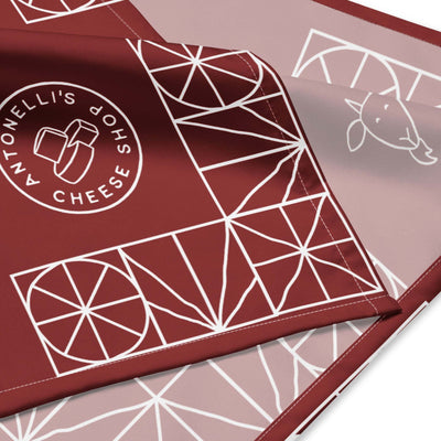 All-over print bandana with geometric design and branding, made of lightweight microfiber polyester.