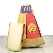 Comte cheese by Marcel Petite from France, raw cow's milk, firm texture.