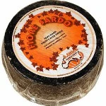 MITICA SARDO cheese wheel from Sardinia, aged 8 months, rich sheep milk cheese with dark rind and vibrant interior.